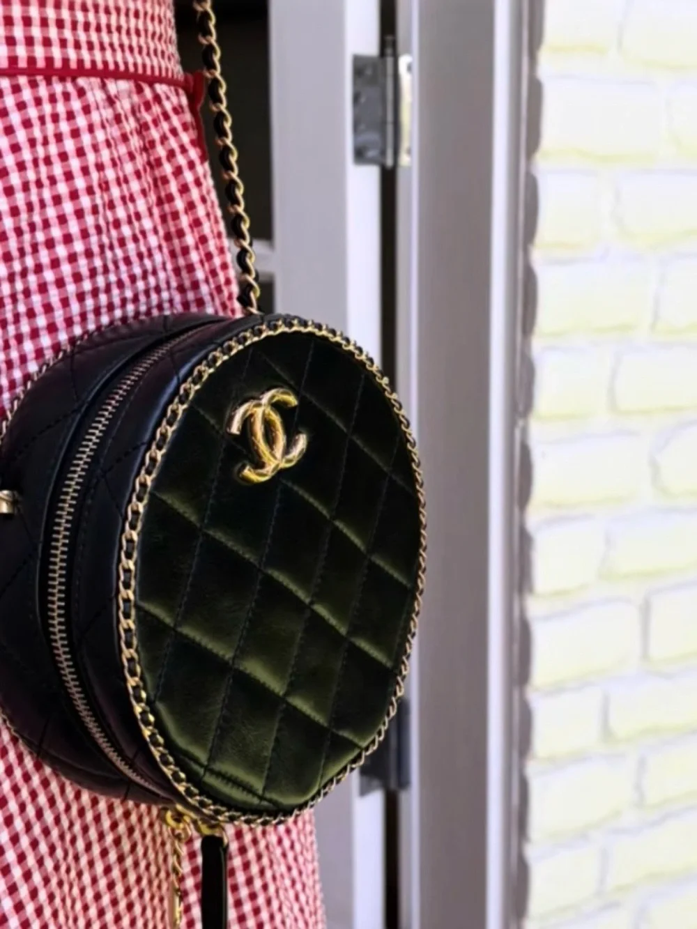 CHANEL Black Quilted Round Crossbody with Gold CC